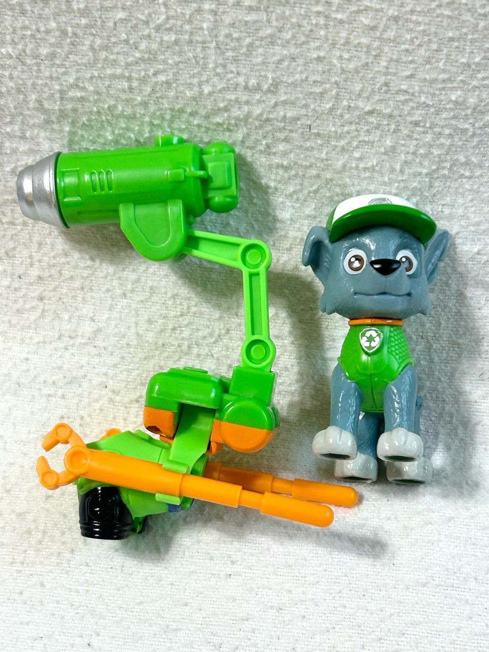 Paw Patrol The Movie Rocky Action Figure with Projectile Launcher.